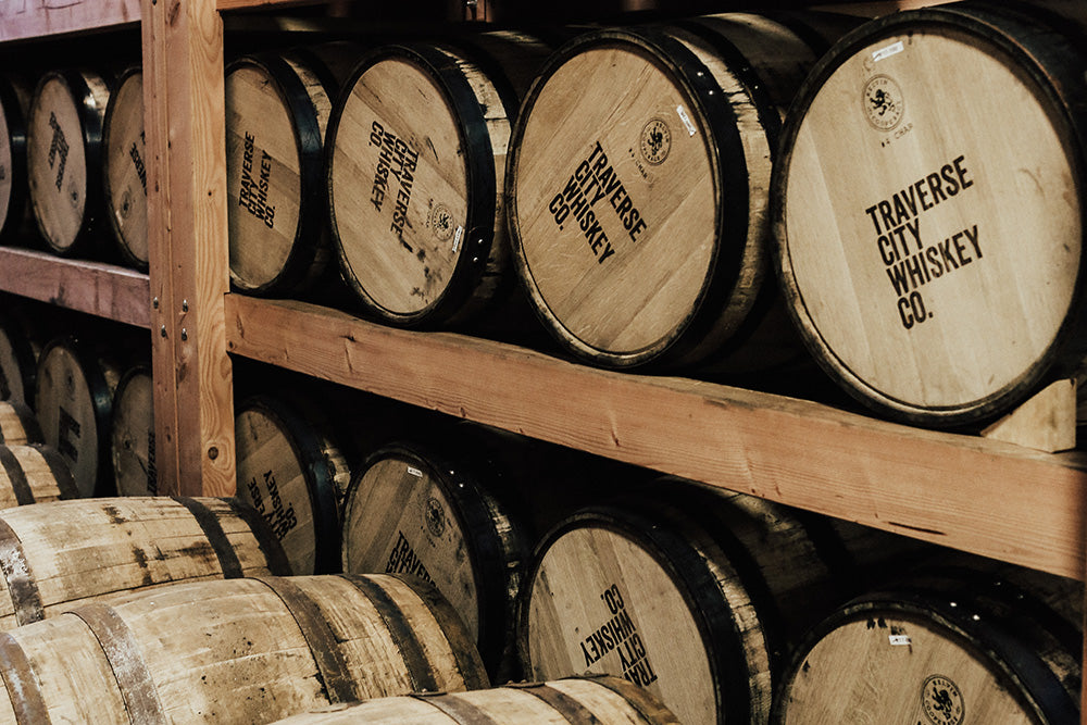Whiskey barrels aging in the rickhouse