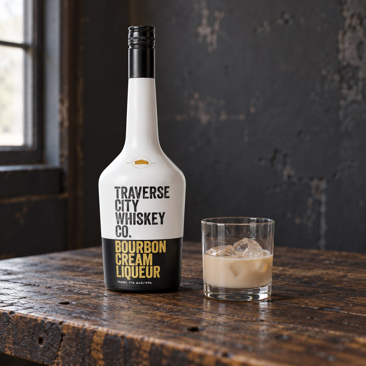 Harvest Cream bourbon cream liqueur bottle with a glass on ice