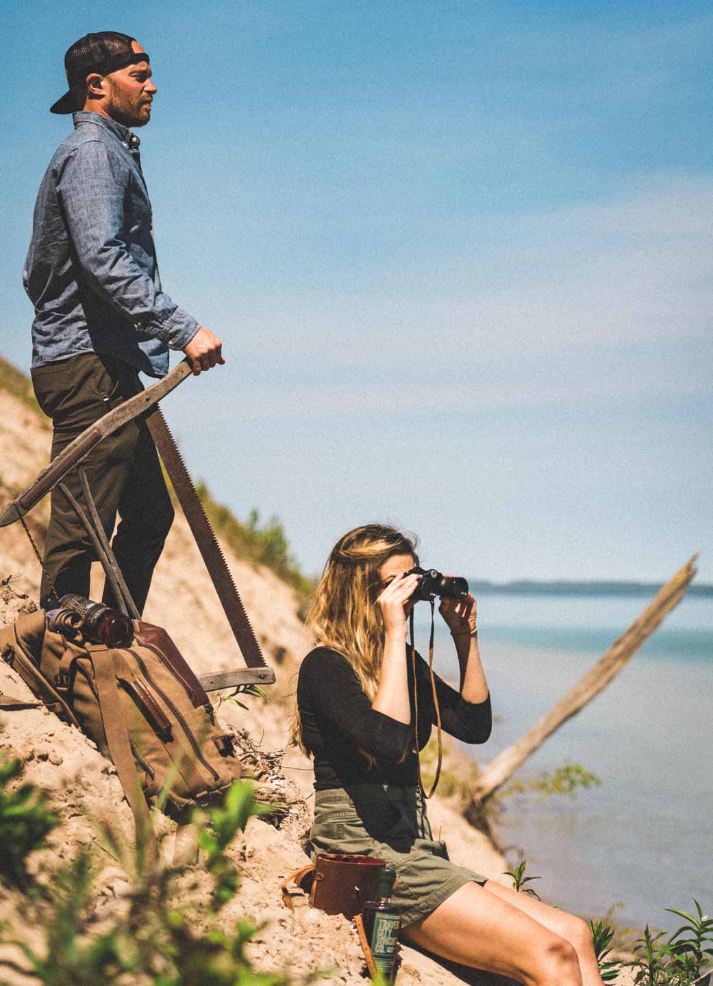 Two hikers looking out over Lake Michigan from a bluff