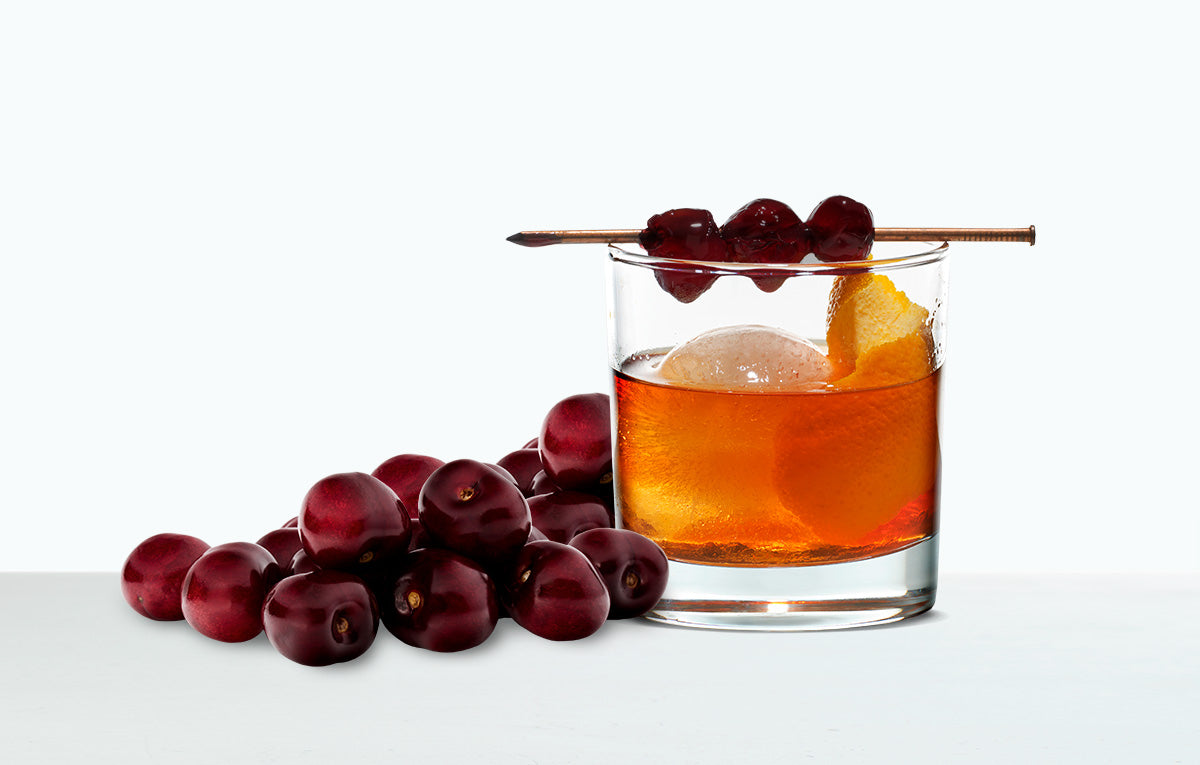 Cherry Old Fashioned cocktail with fresh cherries