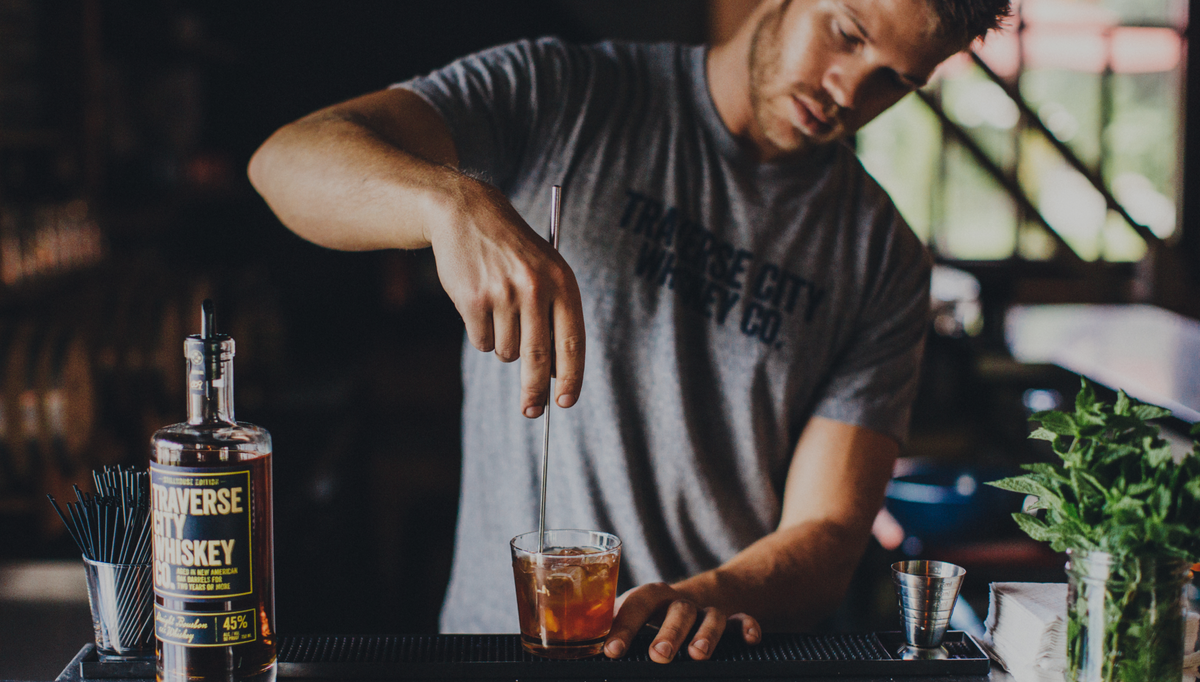 Bartender making Whiskey Cocktail
