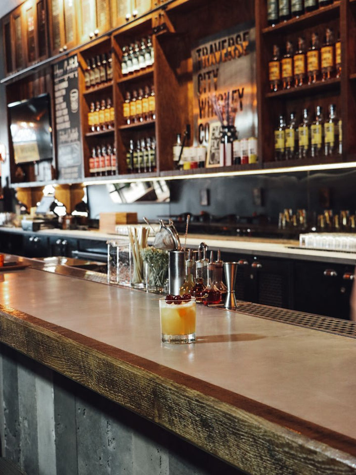 The bar at the Outpost, lined with Traverse City Whiskey Co. bottles